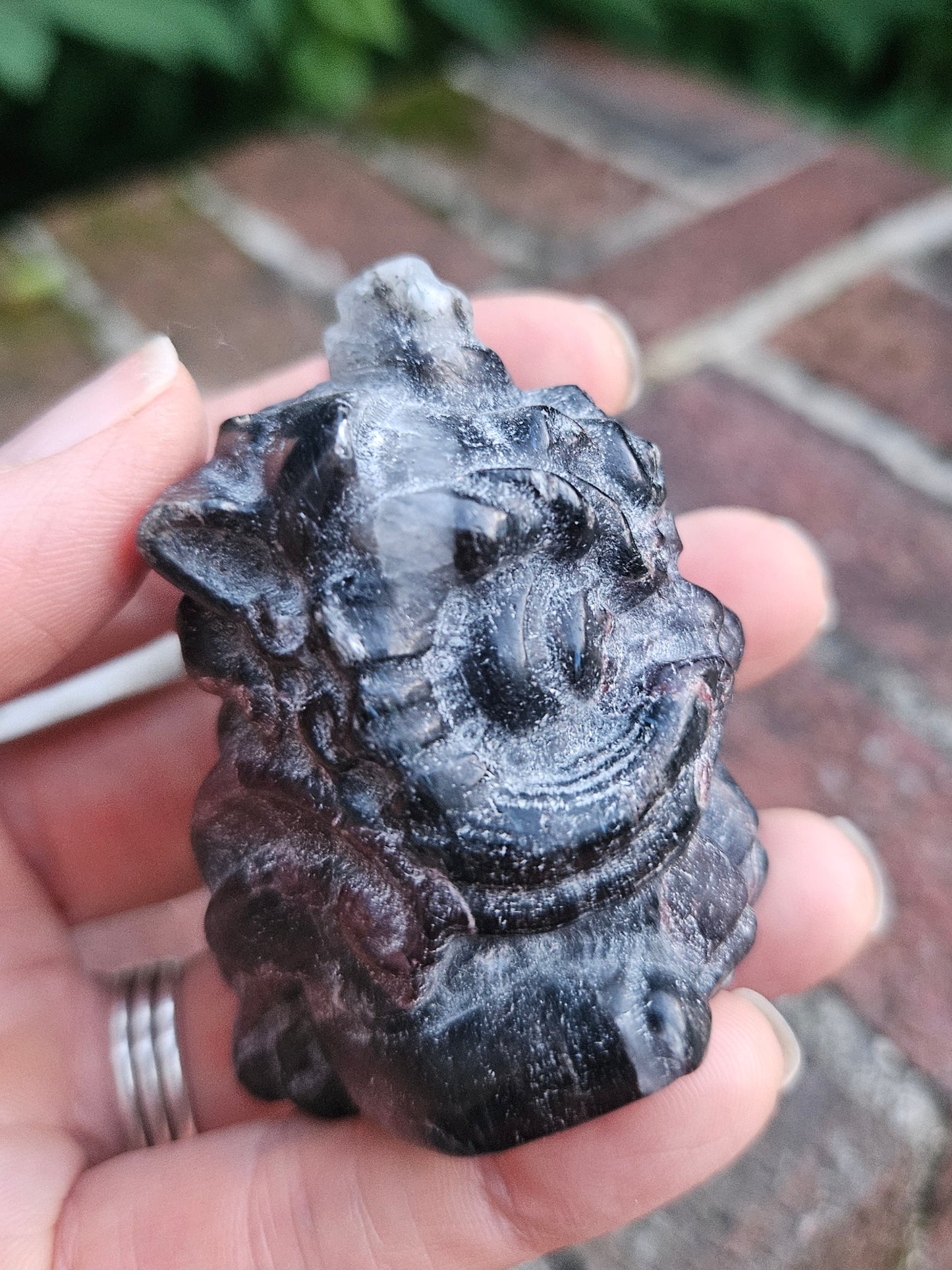 Garnet dragon carving with Quartz inclusion