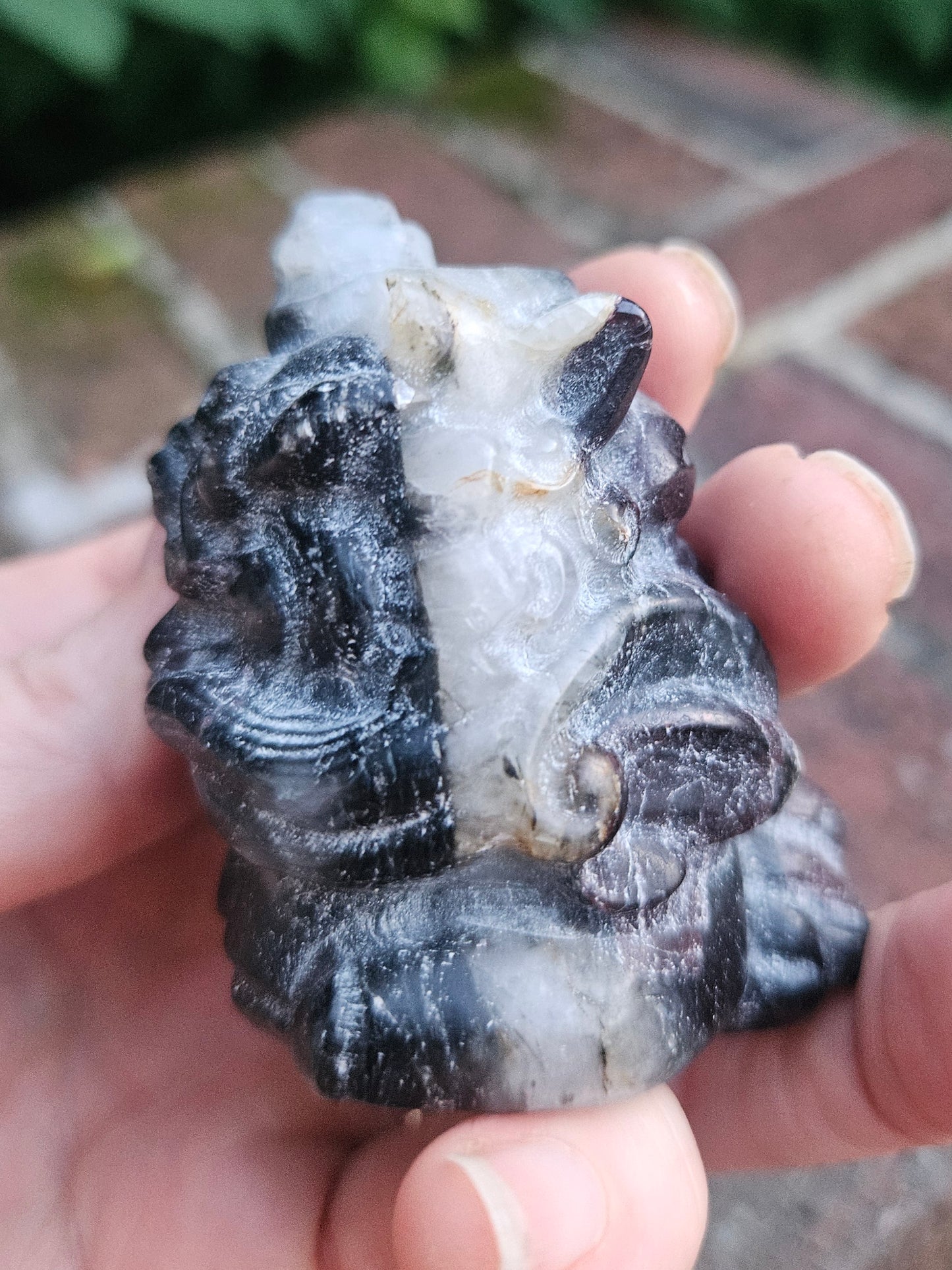 Garnet dragon carving with Quartz inclusion