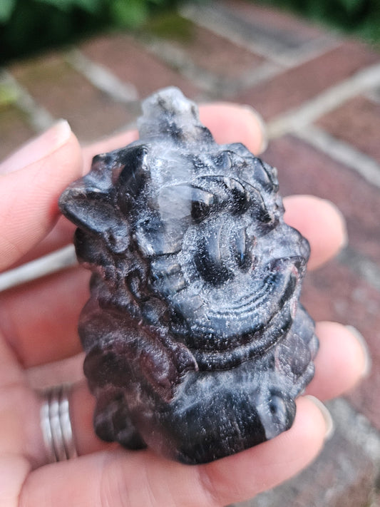 Garnet dragon carving with Quartz inclusion